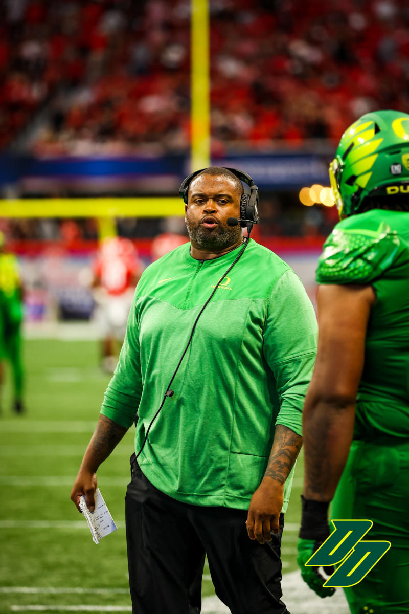 Oregon offensive line coach Adrian Klemm coaching vs. the Georgia Bulldogs in Atlanta.